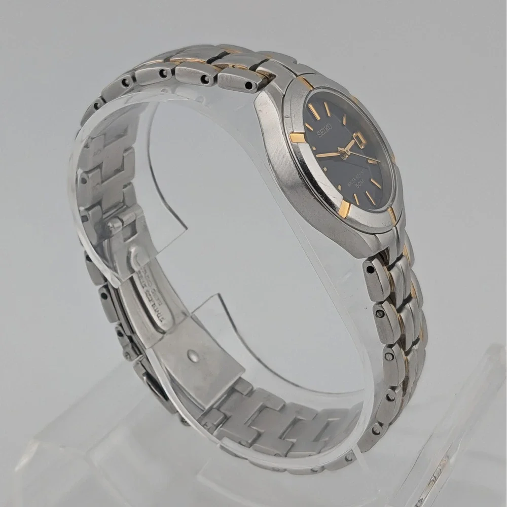 Seiko 7N82-0AG0 Blue Sunburst Two Tone Date Quartz Watch 50M‎